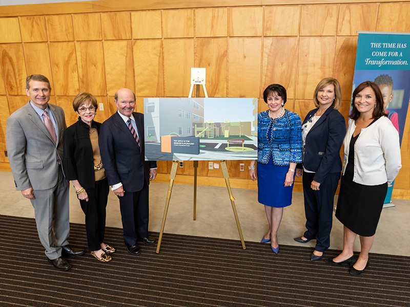 Showing an architectural rendering of the new Gayle and Tom Benson Charitable Foundation Playground in honor of Sanderson Farms are, from left, Children’s of Mississippi CEO Guy Giesecke; Kathy Sanderson and husband, Sanderson Farms CEO and board chairman Joe Sanderson Jr.; Gayle Benson; Dr. LouAnn Woodward, vice chancellor for health affairs and dean of the School of Medicine; and Dr. Mary Taylor, Suzan B. Thames Chair, professor and chair of pediatrics.